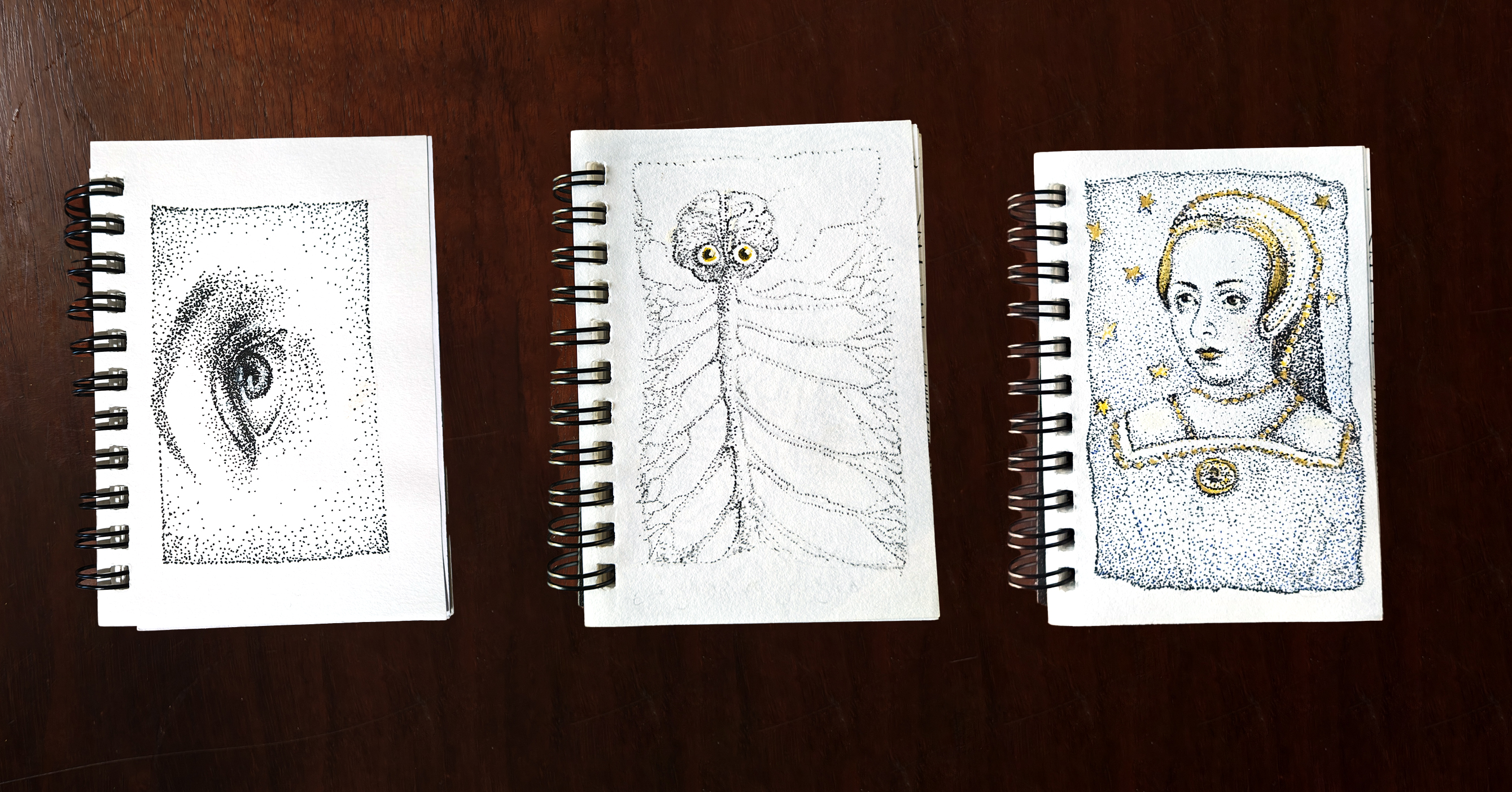 Three tiny stippled drawings